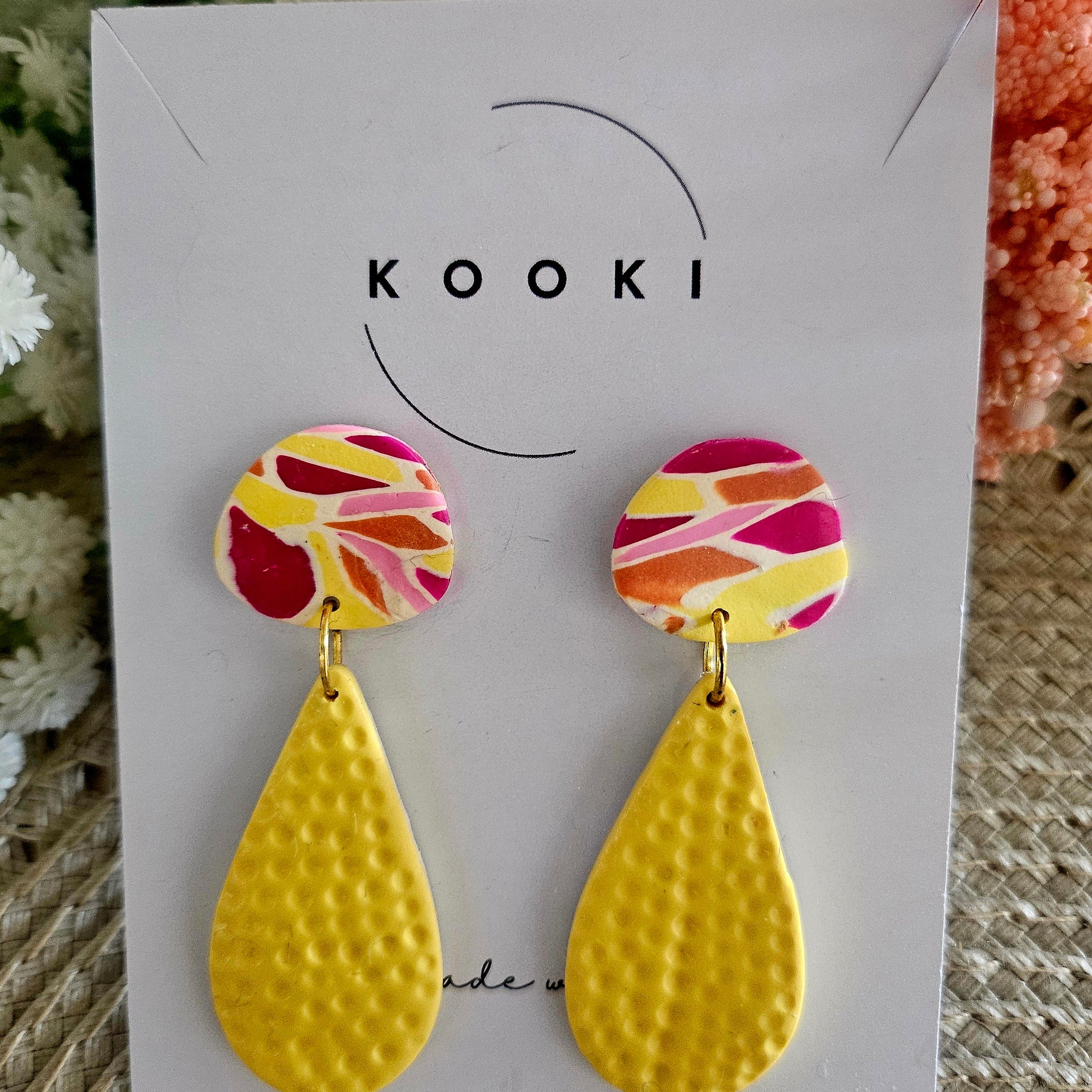 Yellow textured dangle earrings